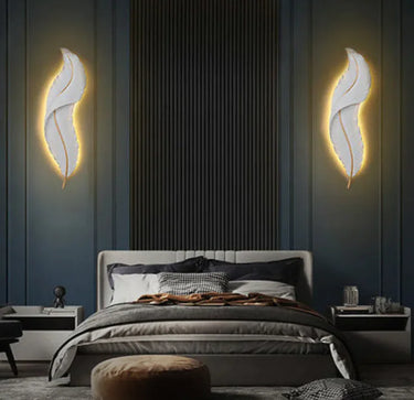 Modern bedroom with decorative wall lights and a bed.