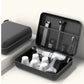 Black hair dryer set with attachments in a carrying case on a white background